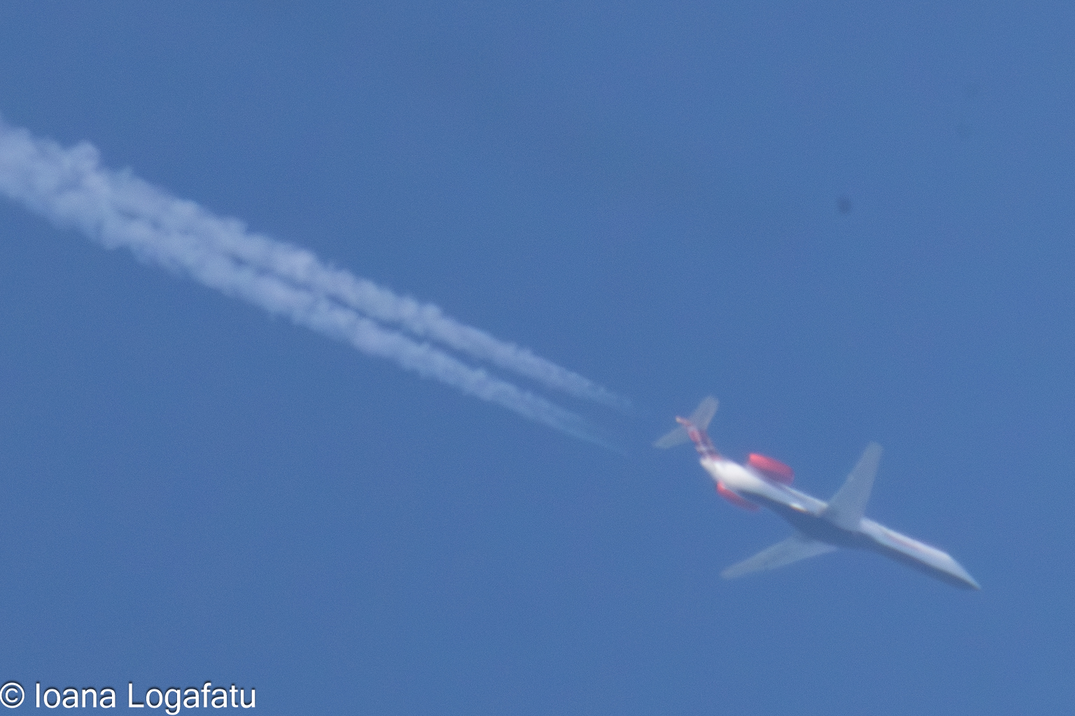 Jets racing across a bright blue sky